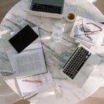 Website strategy planning session with business assessment materials and diagnostic tools.