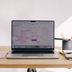 What is an H1 Tag? Minimal workspace with laptop displaying calendar, representing website planning, working with H1 tags, and structure helping to show what an H1 tag is.